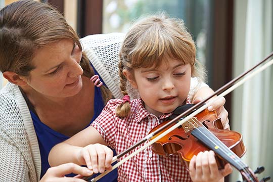 Child having violin tuition